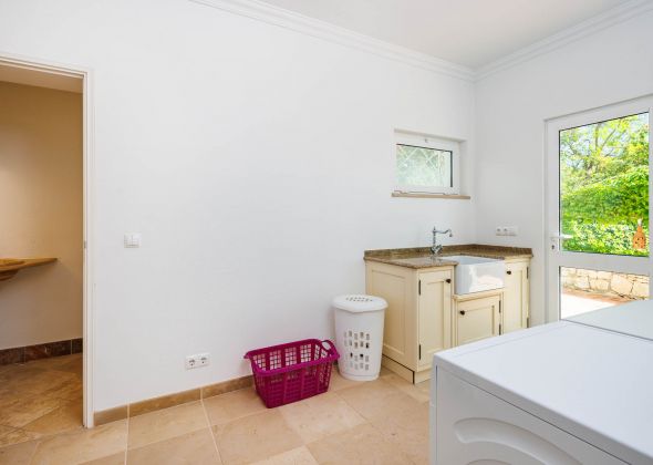 Pool level laundry room